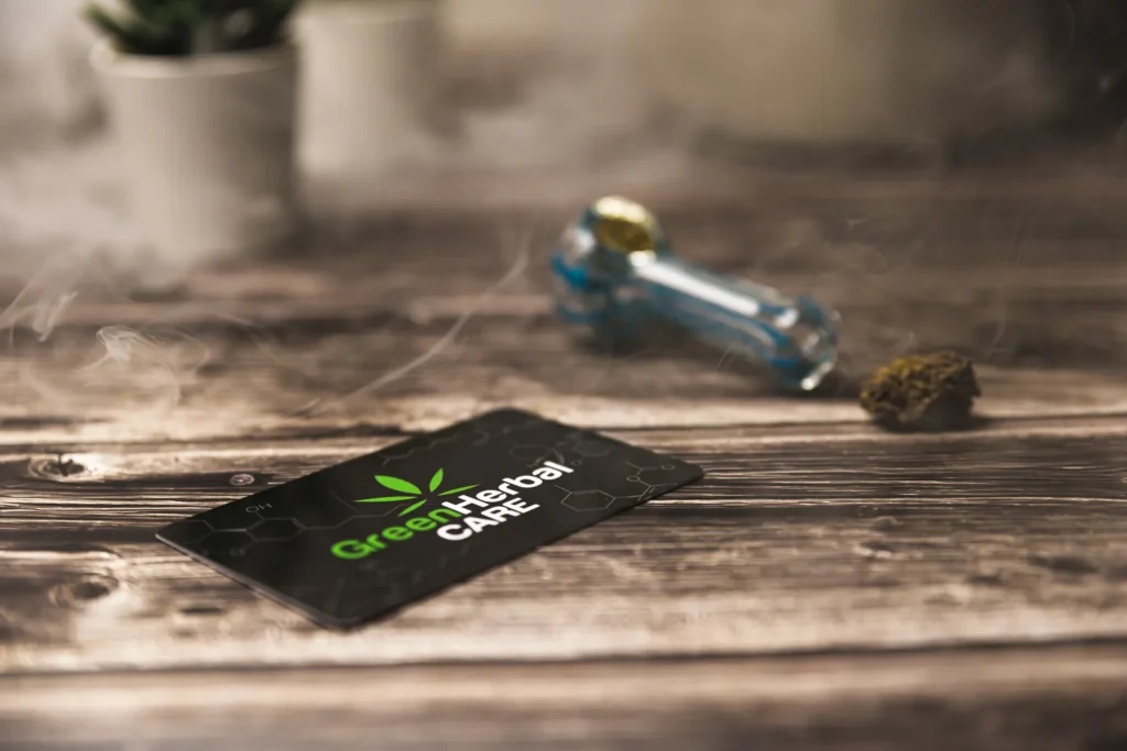 Moody product detail photo with a branded card, small glass piece, and textured wooden surface