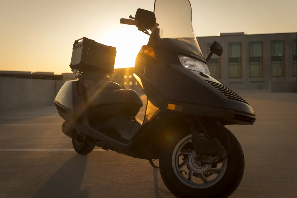 Cinematic scooter photo silhouetted against warm evening light