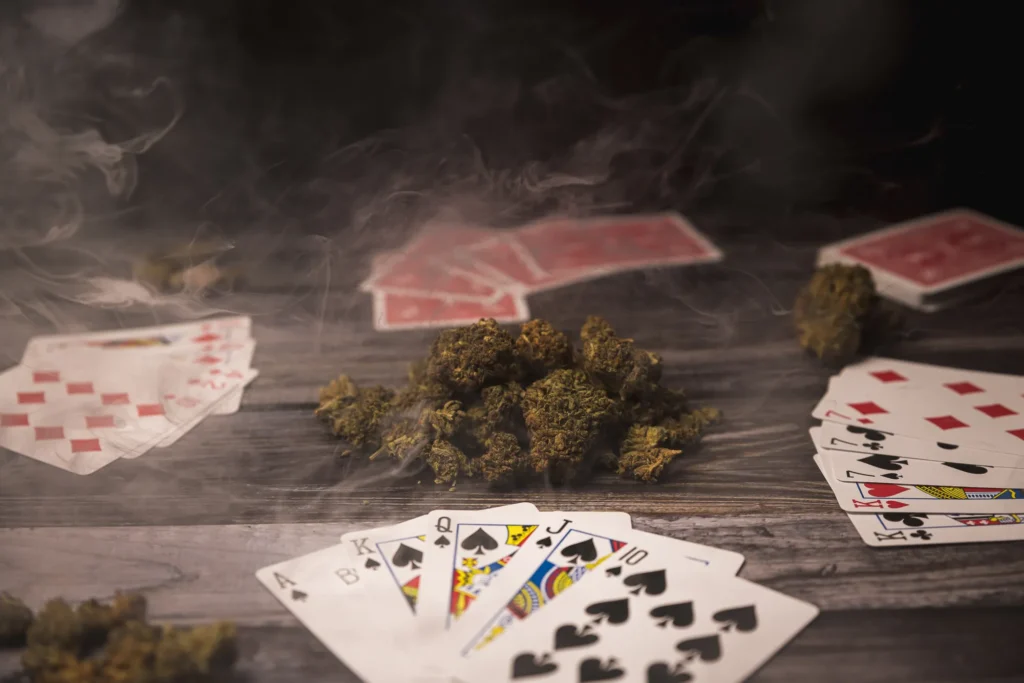 Cinematic product photo with playing cards, smoke, and textured tabletop styling