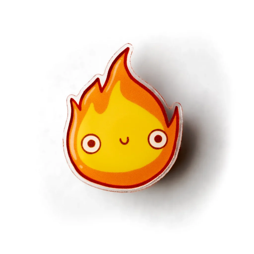 Clean product photo of a small flame-shaped enamel pin on a white background