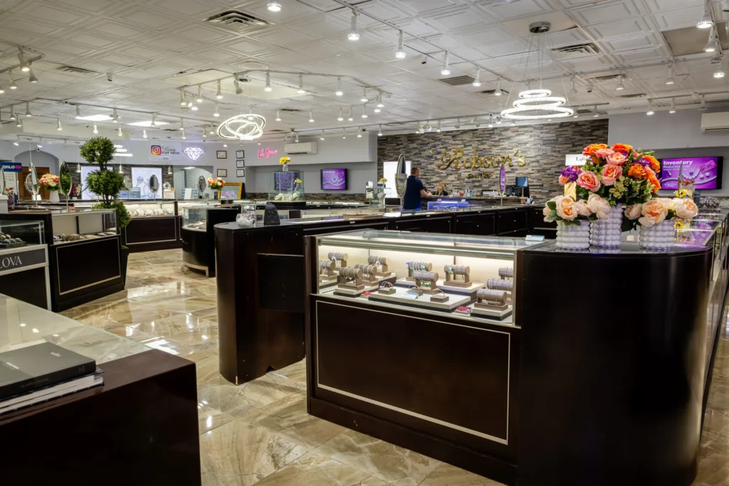 Interior brand photography of Robson's Jewelry showroom with display cases and warm lighting